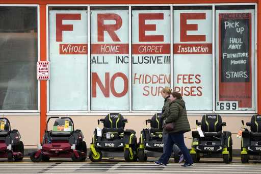 Lawnmowers are displayed outside a Home Depot store in Uniontown, Pa