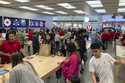 File - People shop at an Apple store in the Westfield Garden State Plaza mall in Paramus, New Jerse…