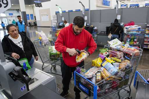 File - Francisco Santana buys groceries at the Walmart Supercenter in North Bergen, N