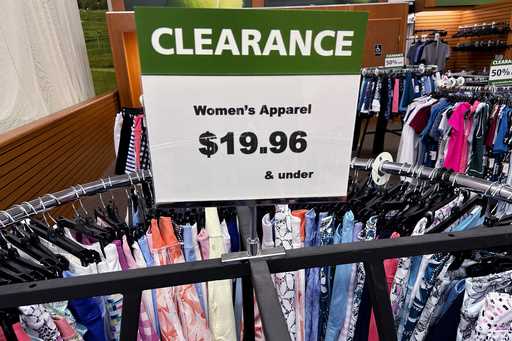 A clearance sign is displayed at a retail clothing store in Downers Grove, Ill