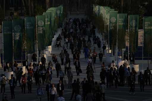 People walk through the COP28 U