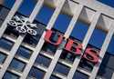 The logo of Swiss bank UBS is fixed on a building where the bank has offices in Frankfurt, Germany,…