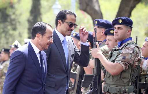 Cyprus' President Nikos Christodoulides, left, and Qatar's Emir Sheikh Tamim bin Hamad al-Thani rev…