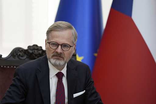 Czech Republic's Prime Minister Petr Fiala listens his Serbian counterpart Milos Vucevic during tal…
