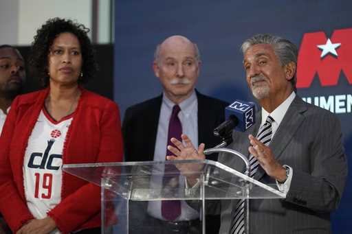 Ted Leonsis, right, owner of the Washington Wizards NBA basketball team and Washington Capitals NHL…