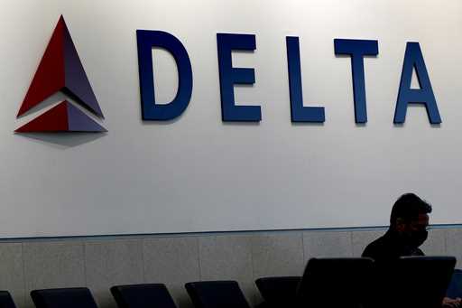 A man waits for a Delta Air Lines flight at Hartsfield-Jackson International Airport in Atlanta, Ja…