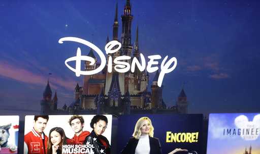 A Disney logo forms part of a menu for the Disney Plus movie and entertainment streaming service on…