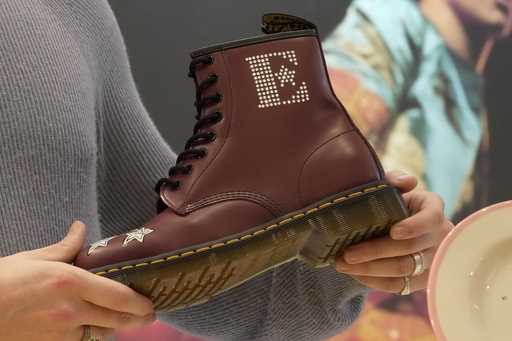A Dr Martens boot inspired by Elton John's famous Pinball Wizard outfit is shown at a promotional e…