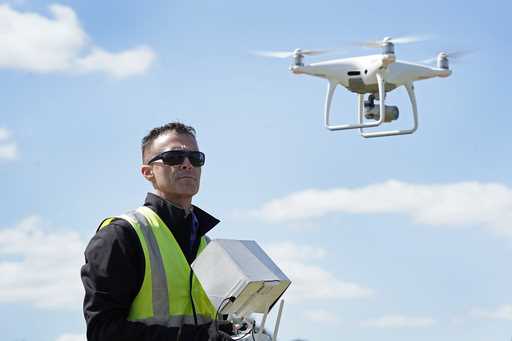 Michael Jones operates his drone, April 2, 2021, in Goldsboro, N