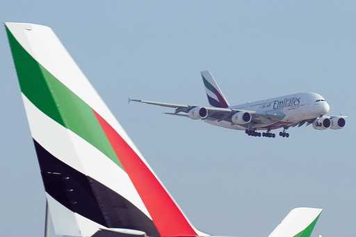 An Emirates Airbus A380 jumbo jet lands at Dubai International Airport in Dubai, United Arab Emirat…