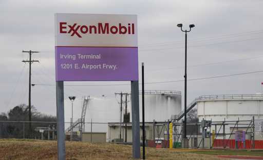File - A sign marks the entrance to an ExxonMobil fuel storage and distribution facility in Irving,…