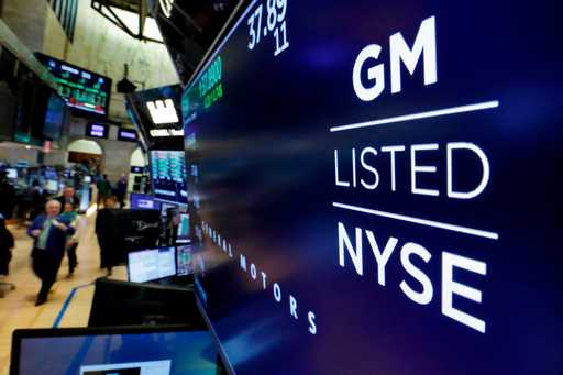 In this April 23, 2018, file photo, the logo for General Motors appears above a trading post on the…