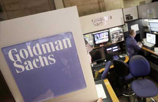 A trader works in the Goldman Sachs booth on the floor of the New York Stock Exchange, March 15, 20…