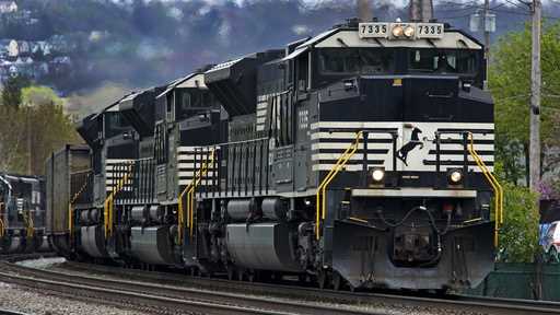 A Norfolk Southern freight train makes it way through Homestead, Pa
