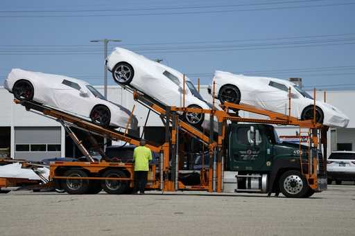 New Corvettes are delivered to a Chevrolet dealer in Wheeling, Ill