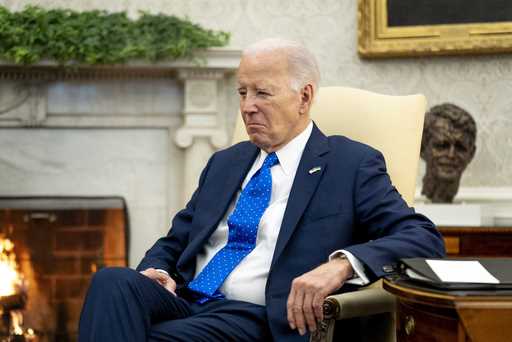 President Joe Biden sits in the Oval Office of the White House, Friday, February 9, 2024, in Washin…