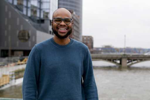 Arick Davis, owner of Last Mile Cafe, poses for a portrait outside of DeVos Place convention center…