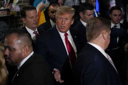 Former President Donald Trump greets supporters during a stop at the Front Street Pub & Eatery, Tue…