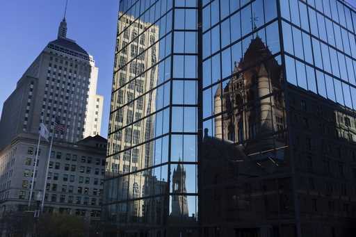 Buildings are reflected in 200 block of Clarendon Street, November 8, 2022, in Boston