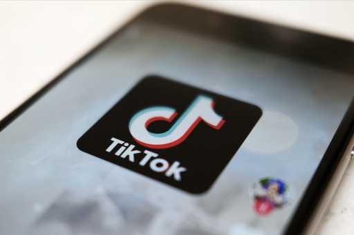 The TikTok logo is displayed on a smartphone screen, Sept