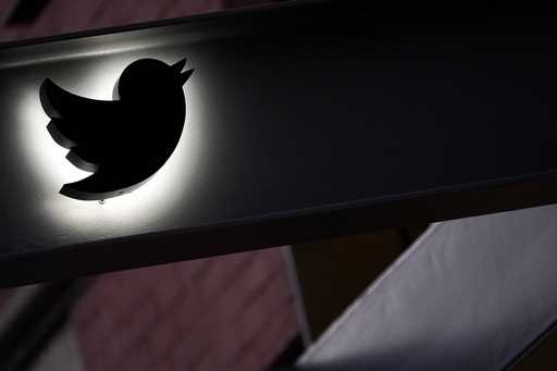 The Twitter logo is seen on the awning of the building that houses the Twitter office in New York, …