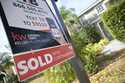 A real estate sign is posted outside of a recently sold home, Tuesday, February 21, 2023, in Valric…