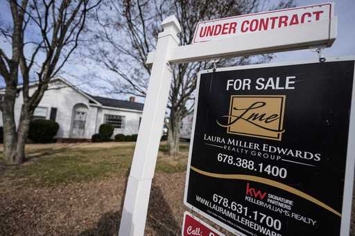 A sign indicating that a home is under contract is shown on Tuesday, January 16, 2024, in Kennesaw,…