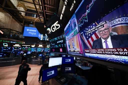 File - Federal Reserve chairman Jerome Powell appears on a video monitor on the floor at the New Yo…