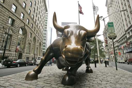 FILE- This October 18, 2008 file photo shows the Charging Bull sculpture in New York City's Financi…