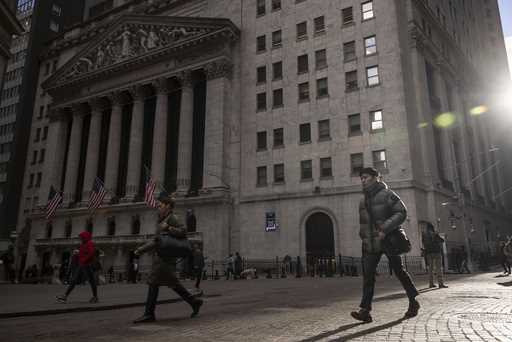 A Security member stands guard at one of the entrance of the New York Stock Exchange in New York, T…