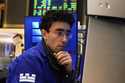 Specialist Alex Weitzman works at his post on the floor of the New York Stock Exchange, Friday, May…