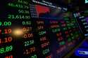 Financial information is displayed as traders work on the floor at the New York Stock Exchange in N…