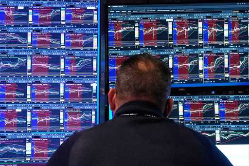 Specialist Anthony Matesic works at his post on the floor of the New York Stock Exchange, Monday, F…