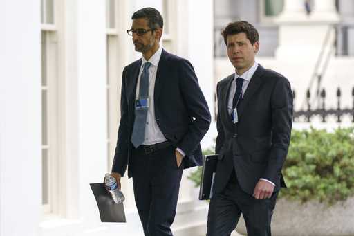 File - Alphabet CEO Sundar Pichai, left, and OpenAI CEO Sam Altman arrive to the White House for a …