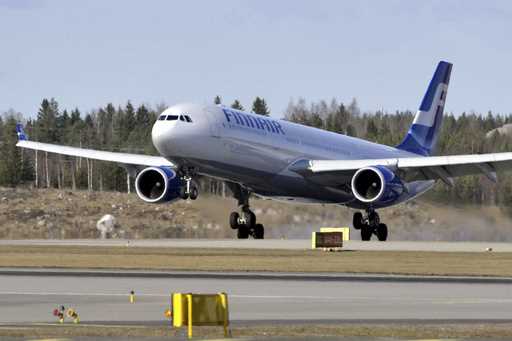 A Finnair plane lands at the Helsinki International Airport in Vantaa, Finland, Monday, April 19, 2…