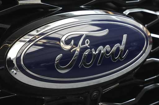 The Ford logo is seen on the grill of a Ford Explorer on display at the Pittsburgh International Au…