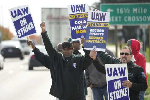 United Auto Workers members walk the picket line during a strike at the Stellantis Sterling Heights…