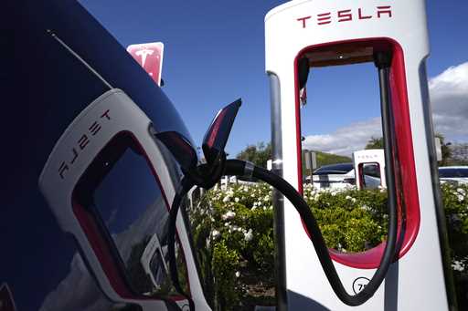 A Tesla auto charges on May 10, 2023, in Westlake, Calif