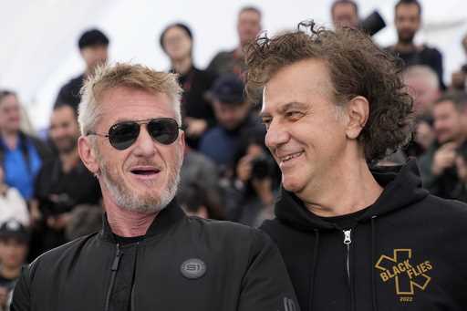 Sean Penn, left, and director Jean-Stephane Sauvaire pose for photographers at the photo call for t…