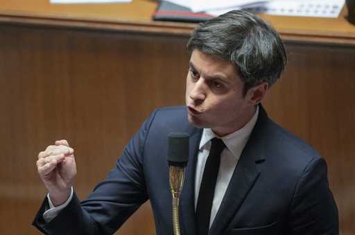 French Prime Minister Gabriel Attal gestures as he speaks during the first session of questions to …