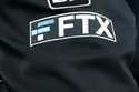 The FTX logo appears on home plate umpire Jansen Visconti's jacket at a baseball game with the Minn…