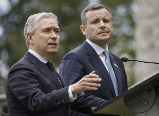 Ukraine Minister of Finance, Sergii Marchenko, right, and Canada's Finance Minister Francois-Philip…