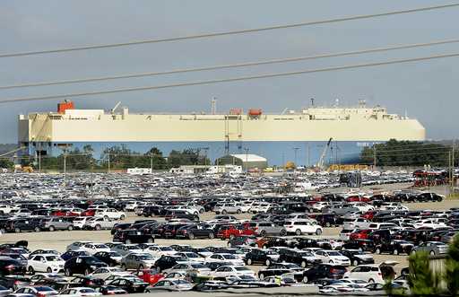 In this October 20, 2015 file photo, new automobiles being shipped through the Port of Brunswick si…
