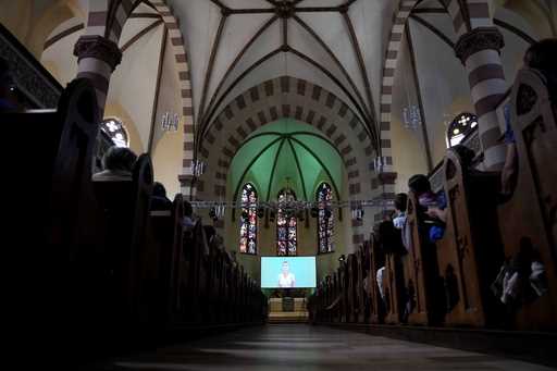 People attend a church service in Nuremberg, Germany, Friday, June 9, 2023