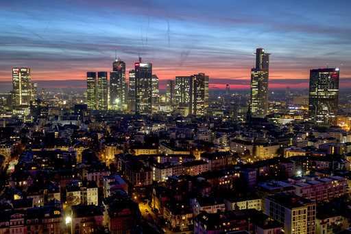 The buildings of the banking district are pictured before sunrise in Frankfurt, Germany, Tuesday, J…