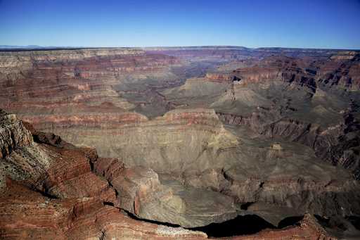 The Grand Canyon National Park is covered in the morning sunlight as seen from a helicopter near Tu…