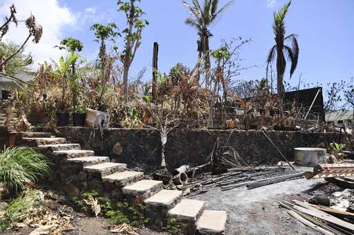 The ruins of a home destroyed by a deadly August wildfire lay outside the boundary of a Hawaiian ho…