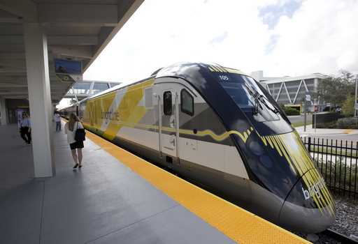 A Brightline train is shown at a station in Fort Lauderdale, Fla