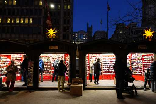 Shoppers visit the Christmas Village in Philadelphia, Wednesday, December 13, 2023