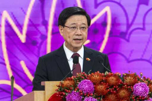 Hong Kong Chief Executive John Lee speaks at a reception following a flag raising ceremony for the …